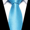A close-up of a bright blue silk jacquard tie against a white shirt background.