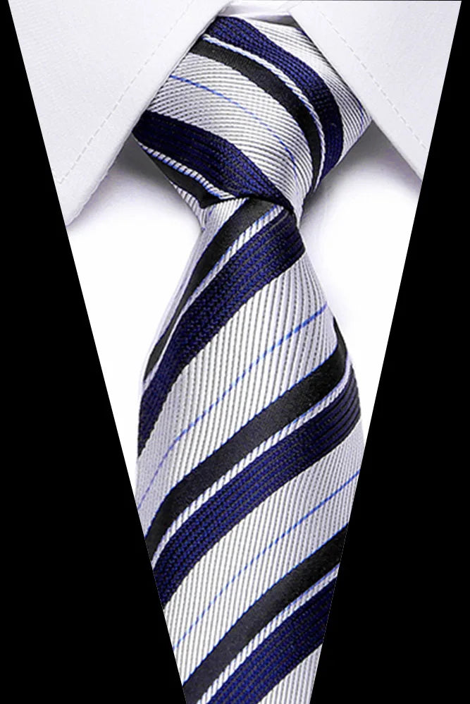 A close-up of a men's silk jacquard tie featuring diagonal stripes in navy blue, gray, and white.