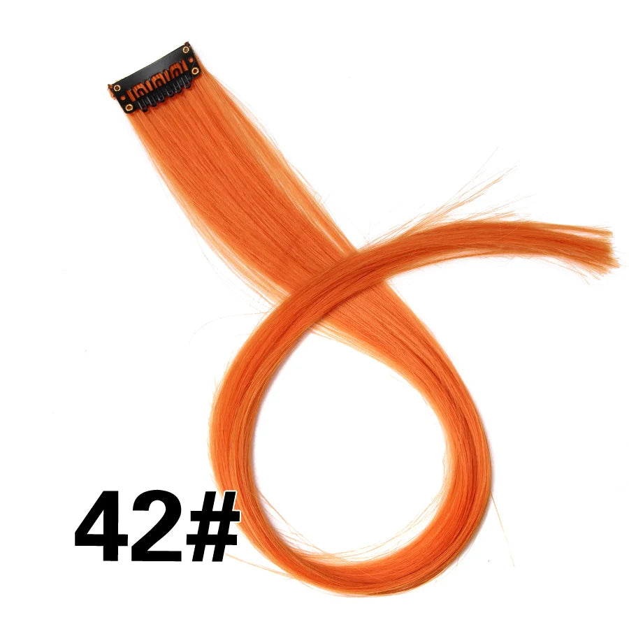A bundle of bright orange synthetic hair extensions with a clip-in attachment.
