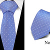 Blue silk jacquard tie folded and displayed against a white background.