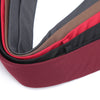 A close-up view of a slim fit wool neck tie in shades of black, brown, and red.