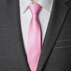 A pink striped tie worn under a gray suit jacket and white shirt.