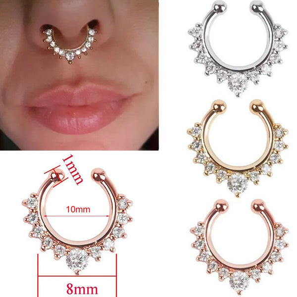 A set of faux septum nose rings in rose gold and silver tones with zircon accents shown against a skin background.
