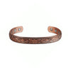 A copper magnetic bangle bracelet featuring a detailed plum flower design.