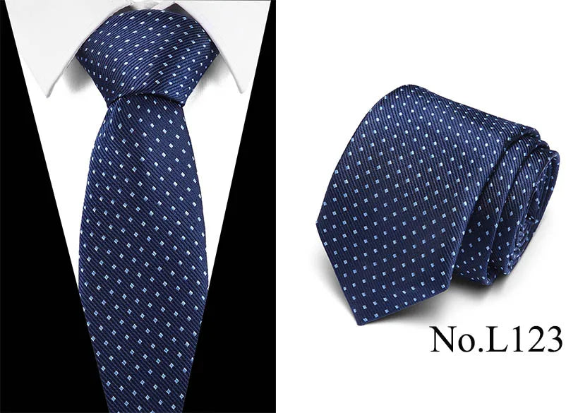 Dark blue silk jacquard tie folded and displayed against a white background.