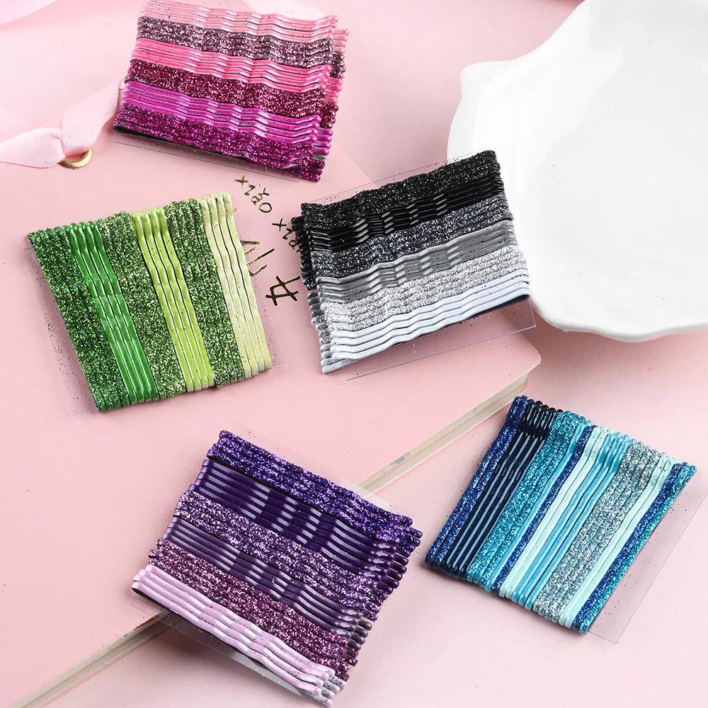 A collection of 24 glitter wavy hair clips and bobby pins in various colors including pink, green, black, and blue.