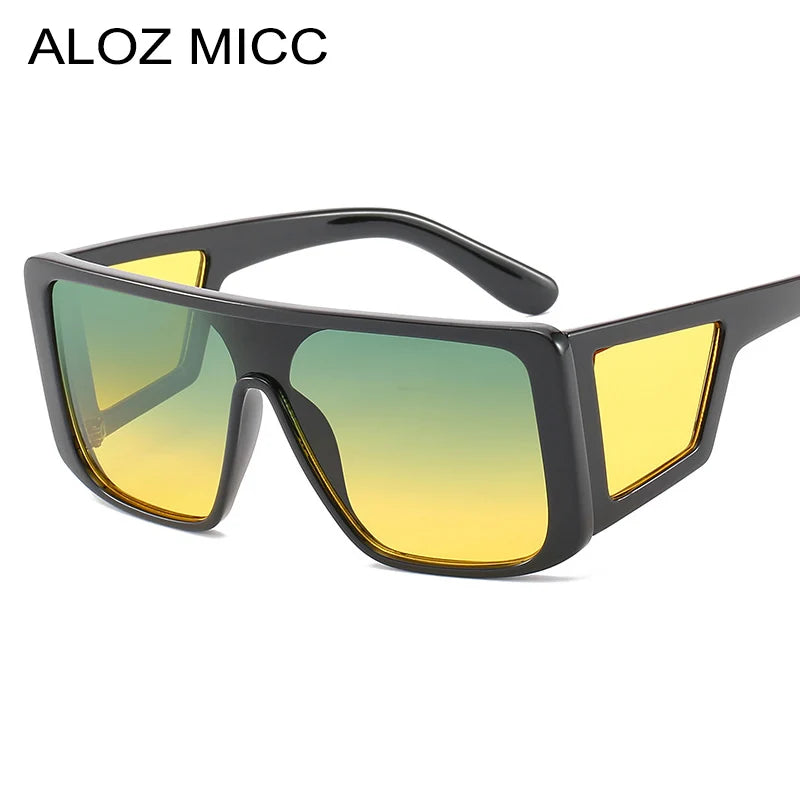 Black oversized square sunglasses with yellow gradient lenses and a black arm.