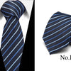 A dark blue striped silk tie shown folded and laid flat against a white background.