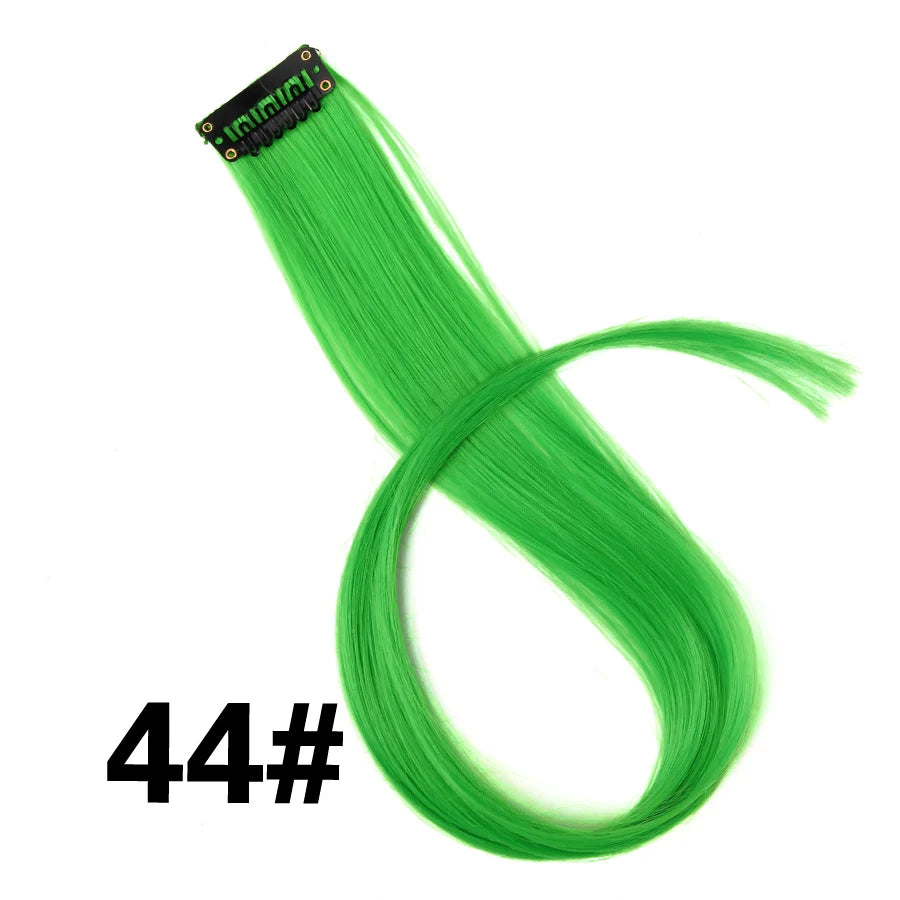 A bundle of bright green synthetic hair extensions with a black clip visible.