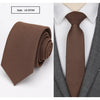 A dark brown slim fit wool neck tie folded and a separate image showing the tie worn with a white shirt and gray suit jacket.