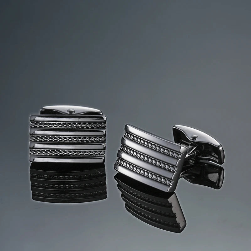 A pair of men's classic copper square cufflinks with a textured, stacked design displayed against a gray background.