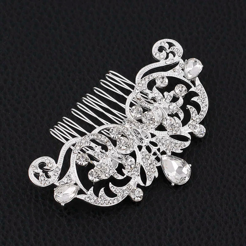 A silver rhinestone bridal hair comb tiara featuring intricate floral designs and small clear stones.