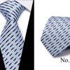 A folded blue and white patterned silk jacquard tie shown against a black background.