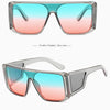 Pair of clear square sunglasses with a gradient lens showing pink and blue colors.