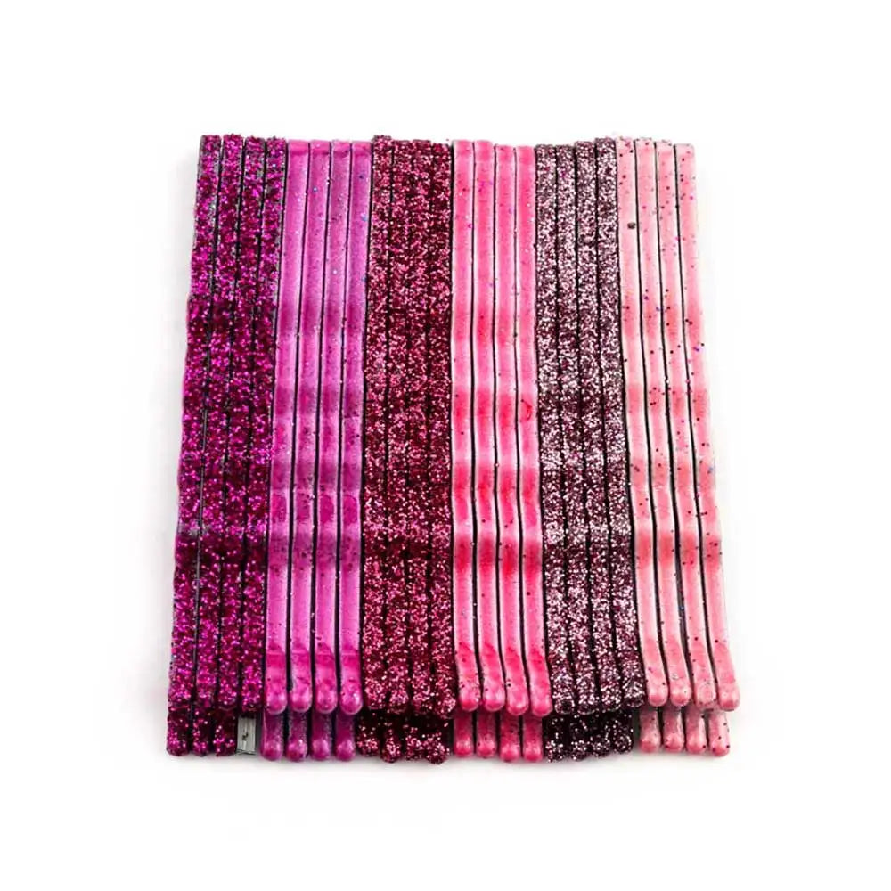 A set of 24 glitter wavy hair clips and bobby pins in various shades of pink and purple.