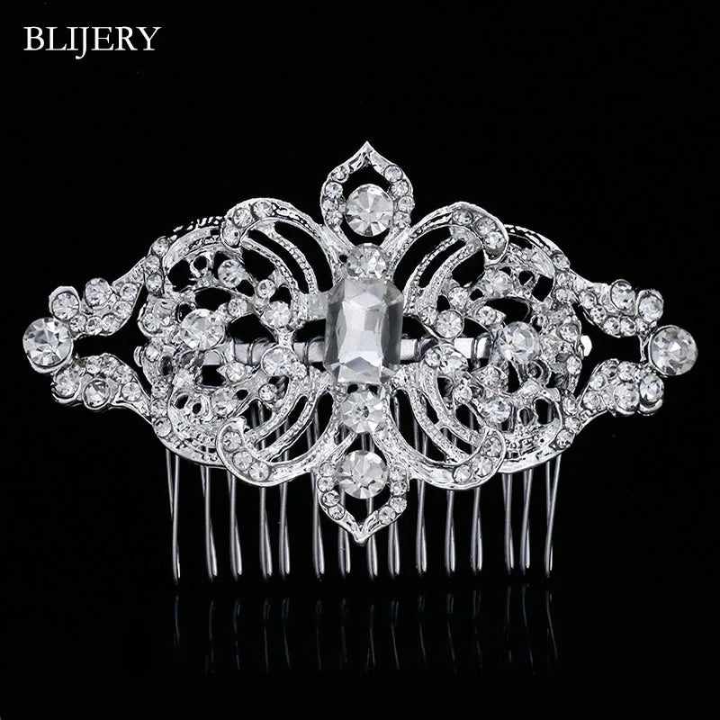A silver rhinestone bridal hair comb tiara featuring intricate floral designs and a central clear stone.