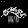 A silver rhinestone bridal hair comb tiara featuring delicate leaves and sparkling stones.