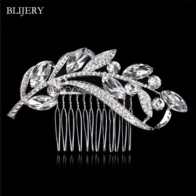 A silver rhinestone bridal hair comb tiara featuring delicate leaves and sparkling stones.