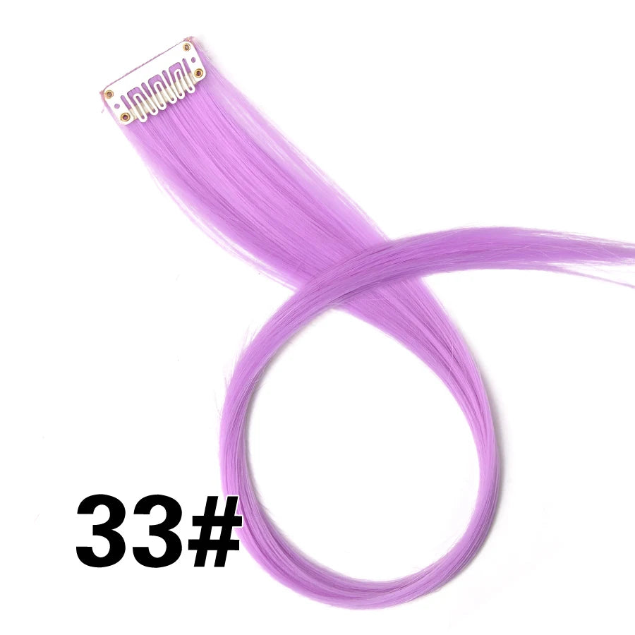 A bundle of long, straight purple synthetic hair extensions with a clip-in attachment.