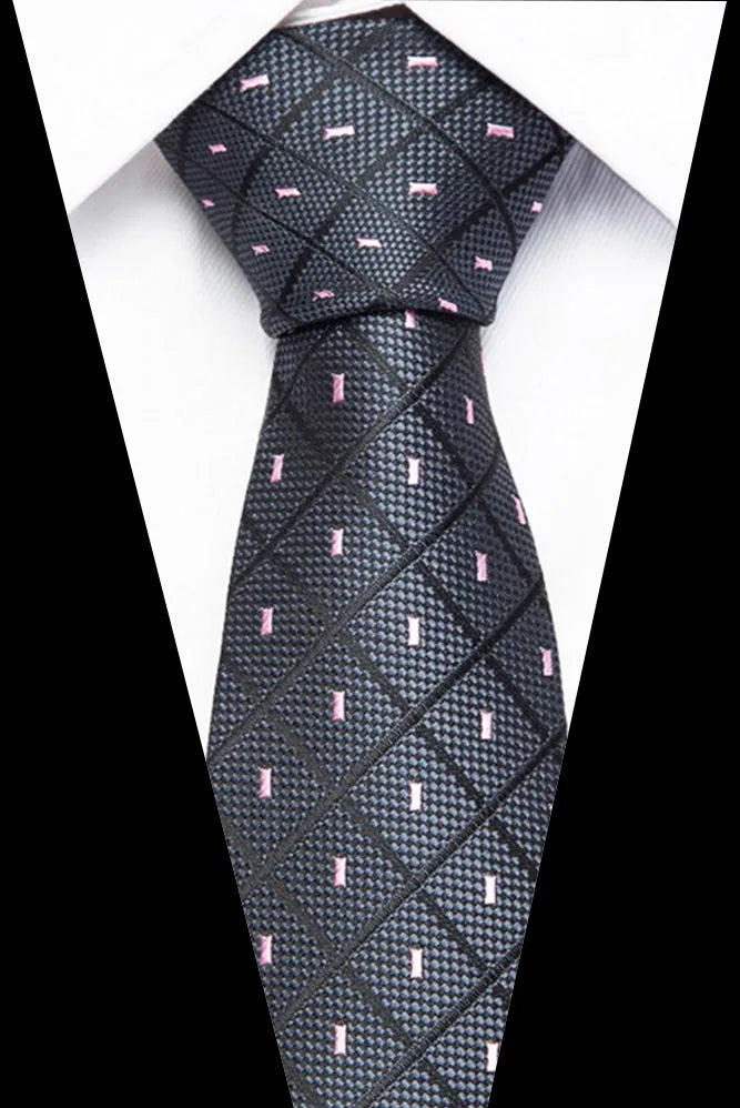 A black silk jacquard tie with a subtle pattern of pink accents.