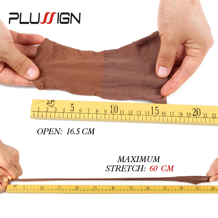 A hand holds a brown stretchable nylon wig cap, demonstrating its size with a ruler.