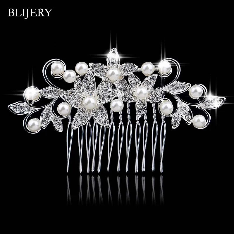 A delicate silver rhinestone bridal hair comb tiara featuring pearl accents and intricate floral designs.