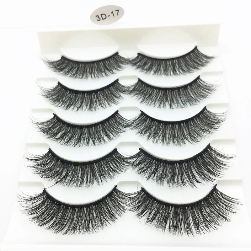 A display of black 3D mink false eyelashes in various styles and lengths.