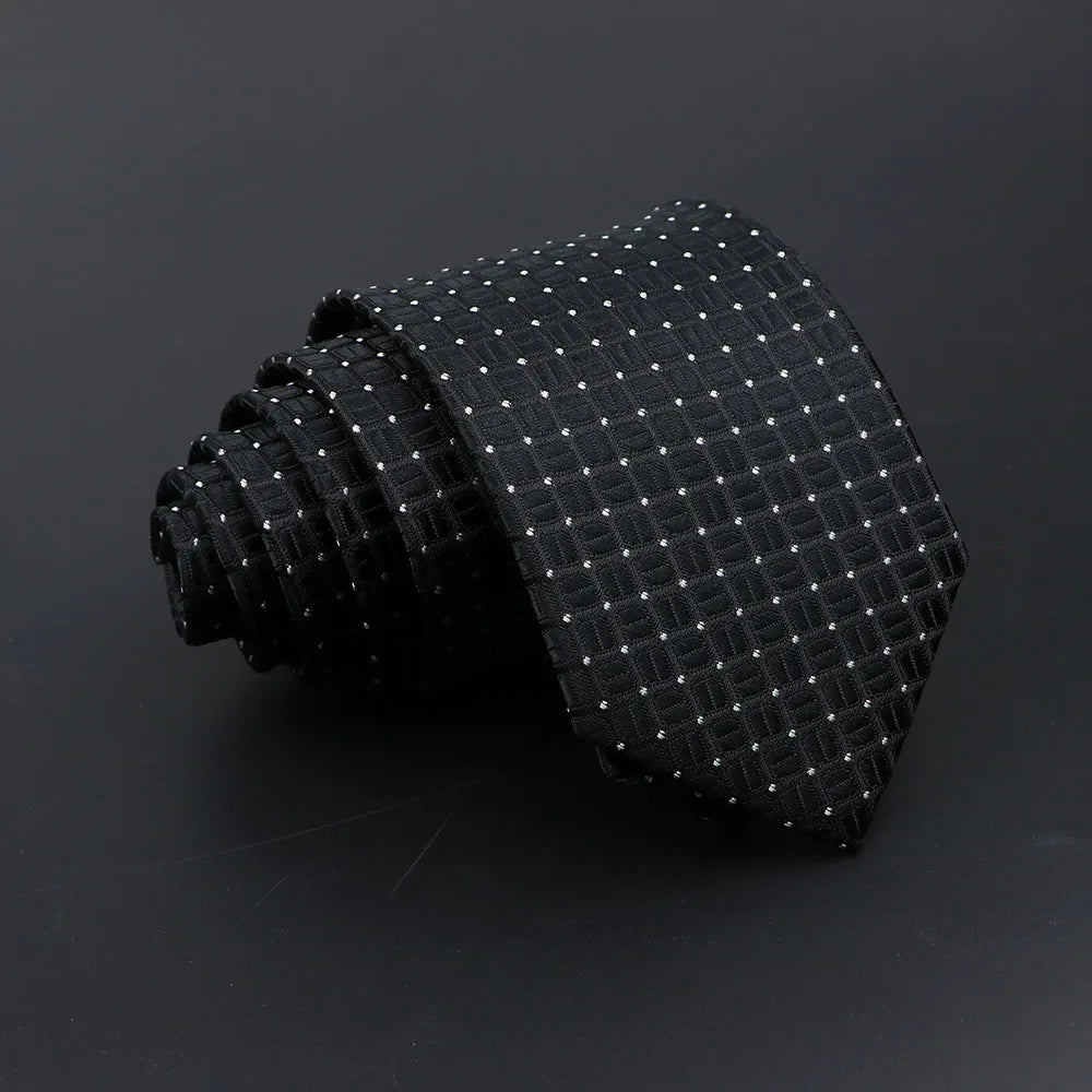A black classic men's tie featuring a subtle plaid pattern of small white dots.