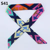 A multi-color silk headband scarf featuring a leopard print pattern in shades of purple, pink, orange, and blue.