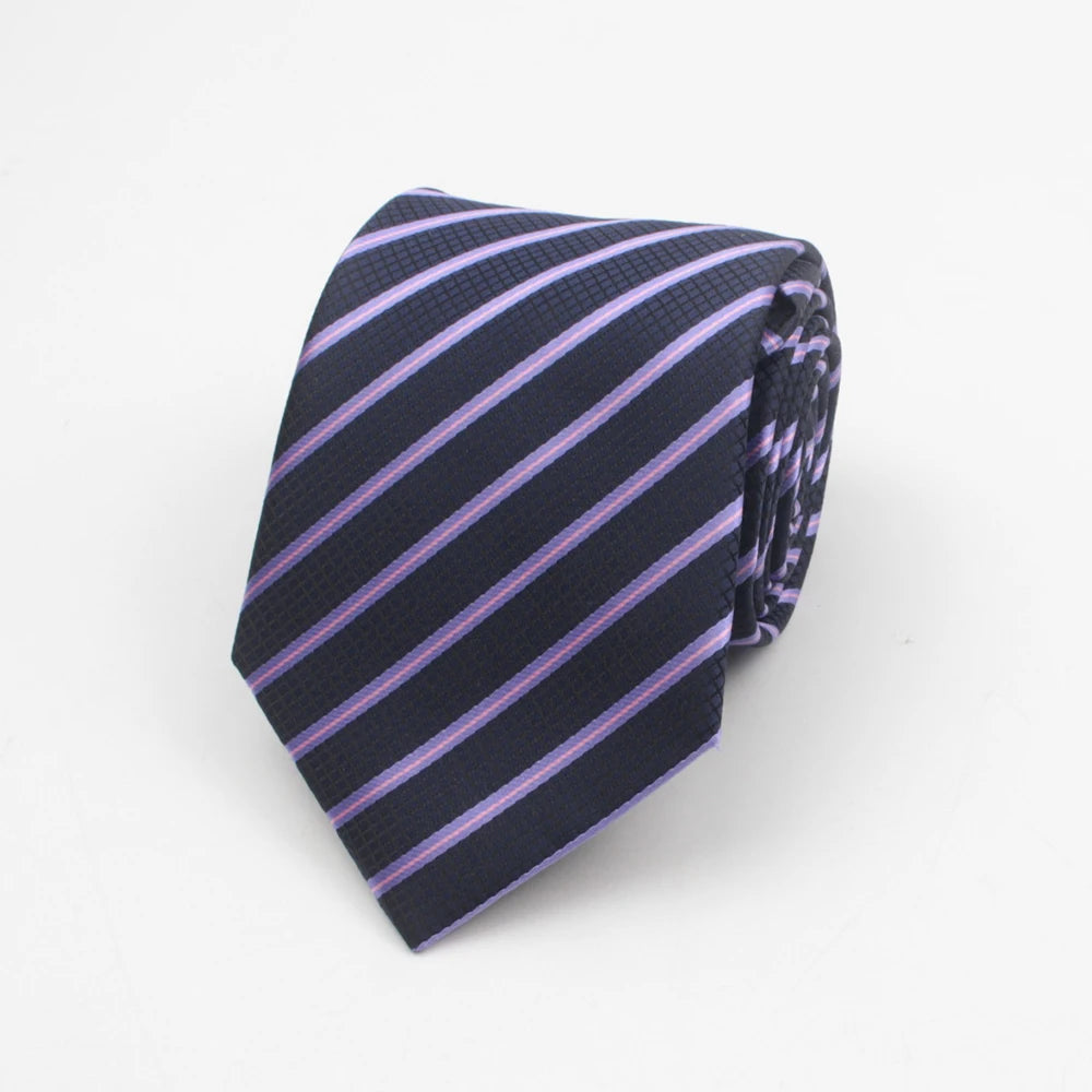 A dark navy necktie with thin pink diagonal stripes and a subtle dot pattern, folded for display.