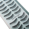 A close-up of a palette showing various styles of black mink false eyelashes.