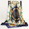 A luxurious satin silk scarf featuring blue, gold, and cream patterns draped elegantly.
