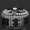 Pulseras de esmalte plateado y negro con números romanos y un diseño de corona.
