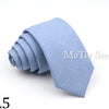 A light blue anti-wrinkle bamboo fiber tie folded neatly on a white background.