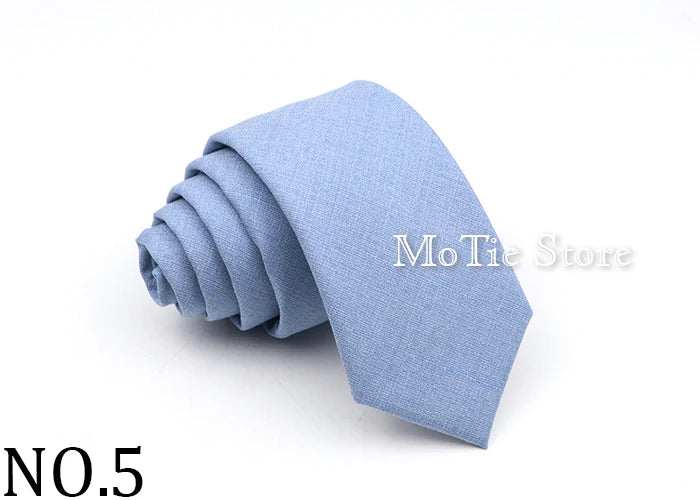 A light blue anti-wrinkle bamboo fiber tie folded neatly on a white background.