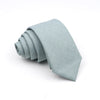 A light blue or gray anti-wrinkle bamboo fiber necktie folded neatly.
