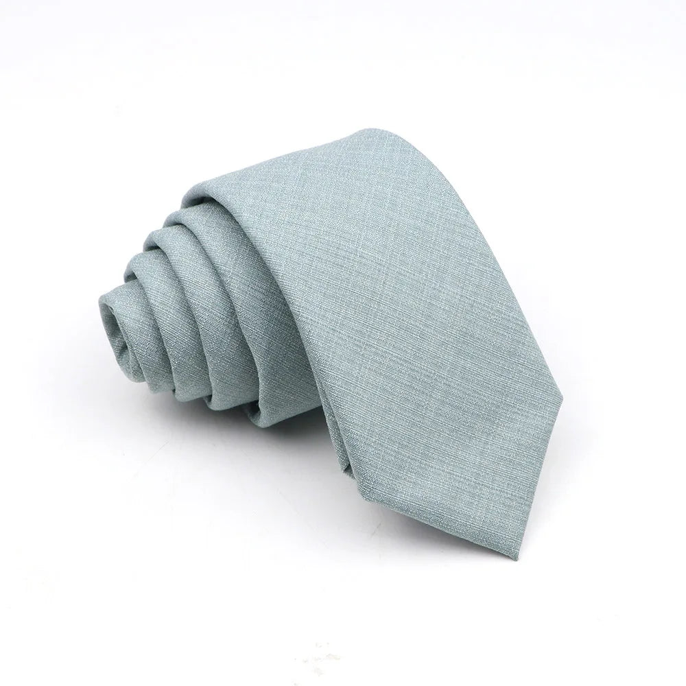 A light blue or gray anti-wrinkle bamboo fiber necktie folded neatly.
