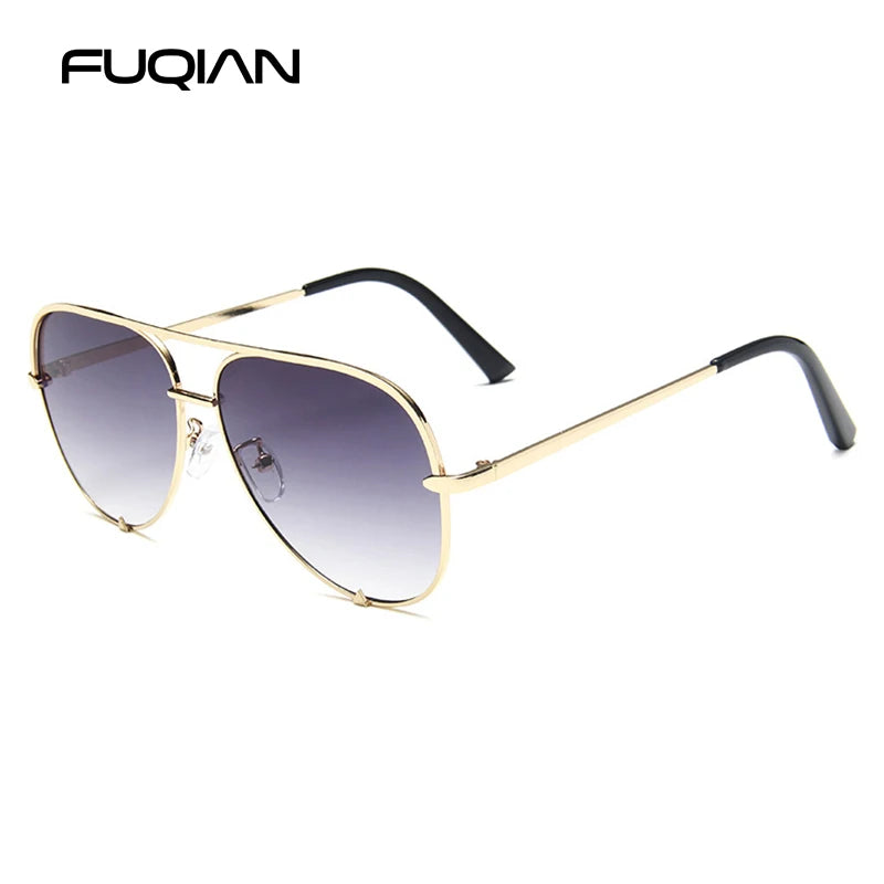 Classic metal aviator sunglasses with a gradient black driver style lens and gold-toned frame.