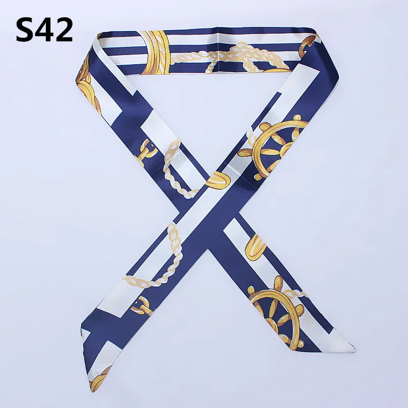 A navy and white striped silk scarf tied in an 'X' shape with gold accents