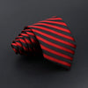 A red and black striped necktie folded into a fan shape on a dark background.