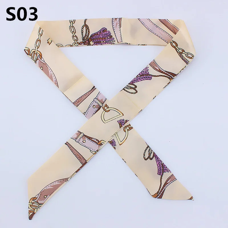 A beige silk headband scarf with a multi-color leopard print pattern.
