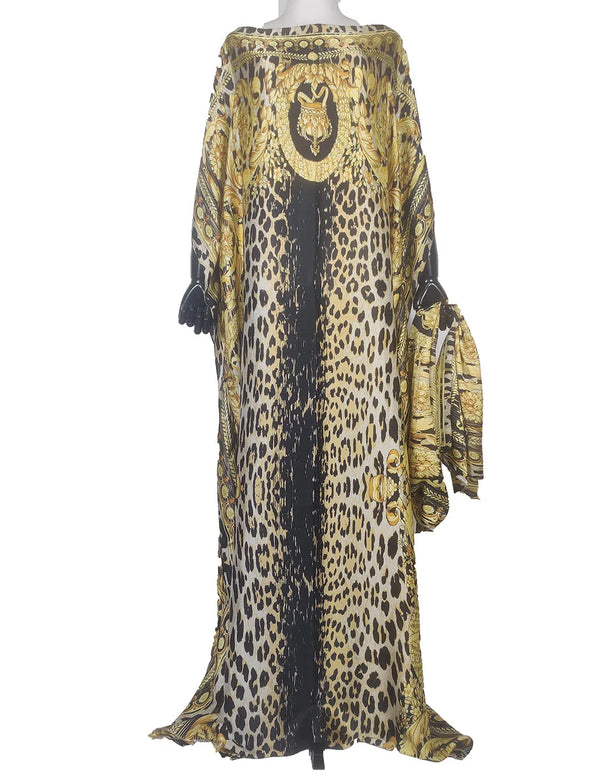 Elegant printed silk kaftan dress featuring a black and gold leopard print