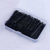 A clear plastic container filled with black metal hair clips for styling.