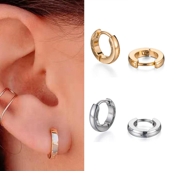 A set of minimalist gold hoop earrings shown on a white background.