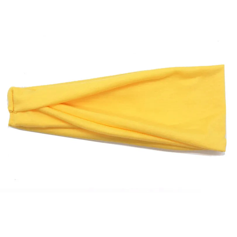 Gelbes Baumwoll-verdrilltes Stirnband, flach dargestellt, zeigt eine weiche Textur.