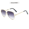 Gold and grey aviator sunglasses with gradient black lenses and black frames