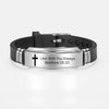 A black leather bracelet with a silver plate engraved with the scripture Matthew 28:20 I am with you always.