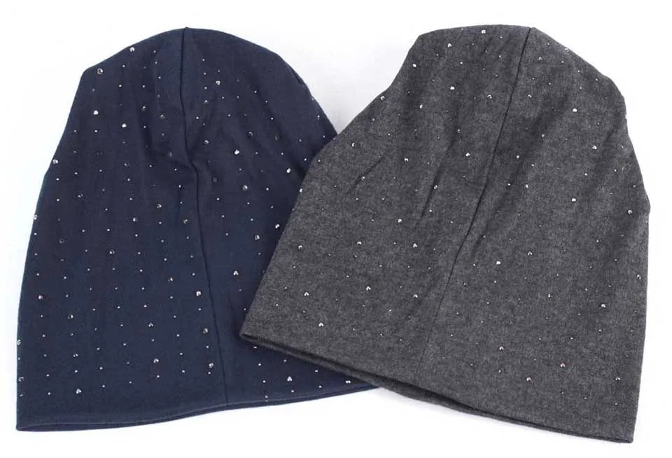 A dark blue and gray knitted beanie hat with scattered silver rhinestones.