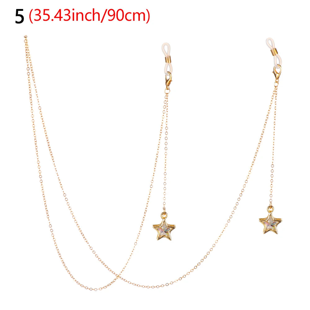 A delicate gold-tone chain necklace with a star pendant and a matching lanyard for eyeglasses.