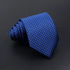 A dark blue men's tie with a subtle plaid or checkered pattern, folded and displayed on a dark surface.